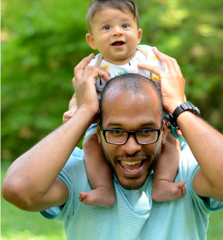 Man with child on shoulders