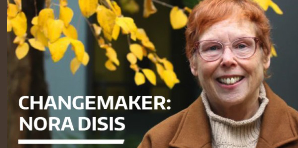 photo of Nora Disis with yellow leafed tree and the words "Changemaker: Nora Disis"