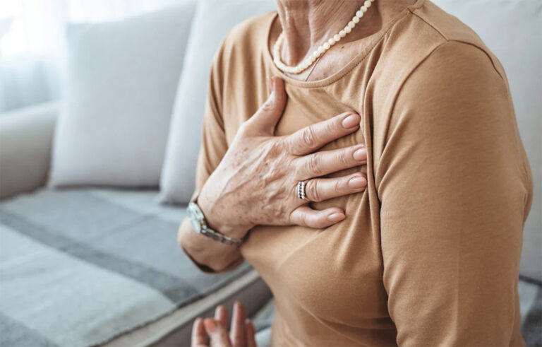 woman with hand over heart