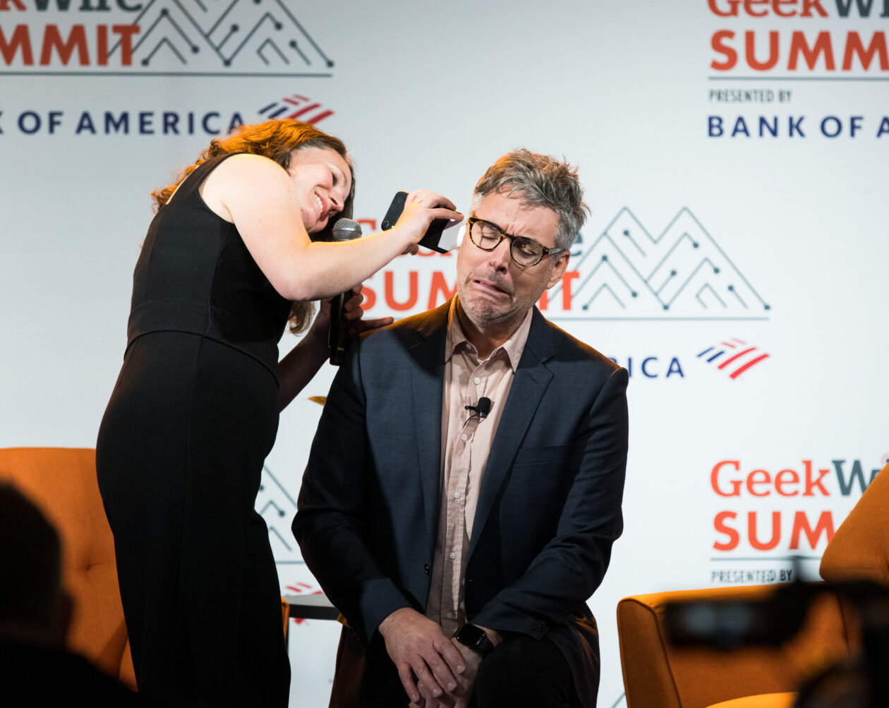 Arna Ionescu Stoll, CEO of ear infection detector Wavely Diagnostics, with GeekWire reporter Kurt Schlosser during the Inventions We Love Showcase at the GeekWire Summit at Block 41 in Seattle, Thursday, October 6, 2022. (GeekWire Photo / Dan DeLong)