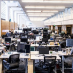 widest of Startup Hall with people at desks in room