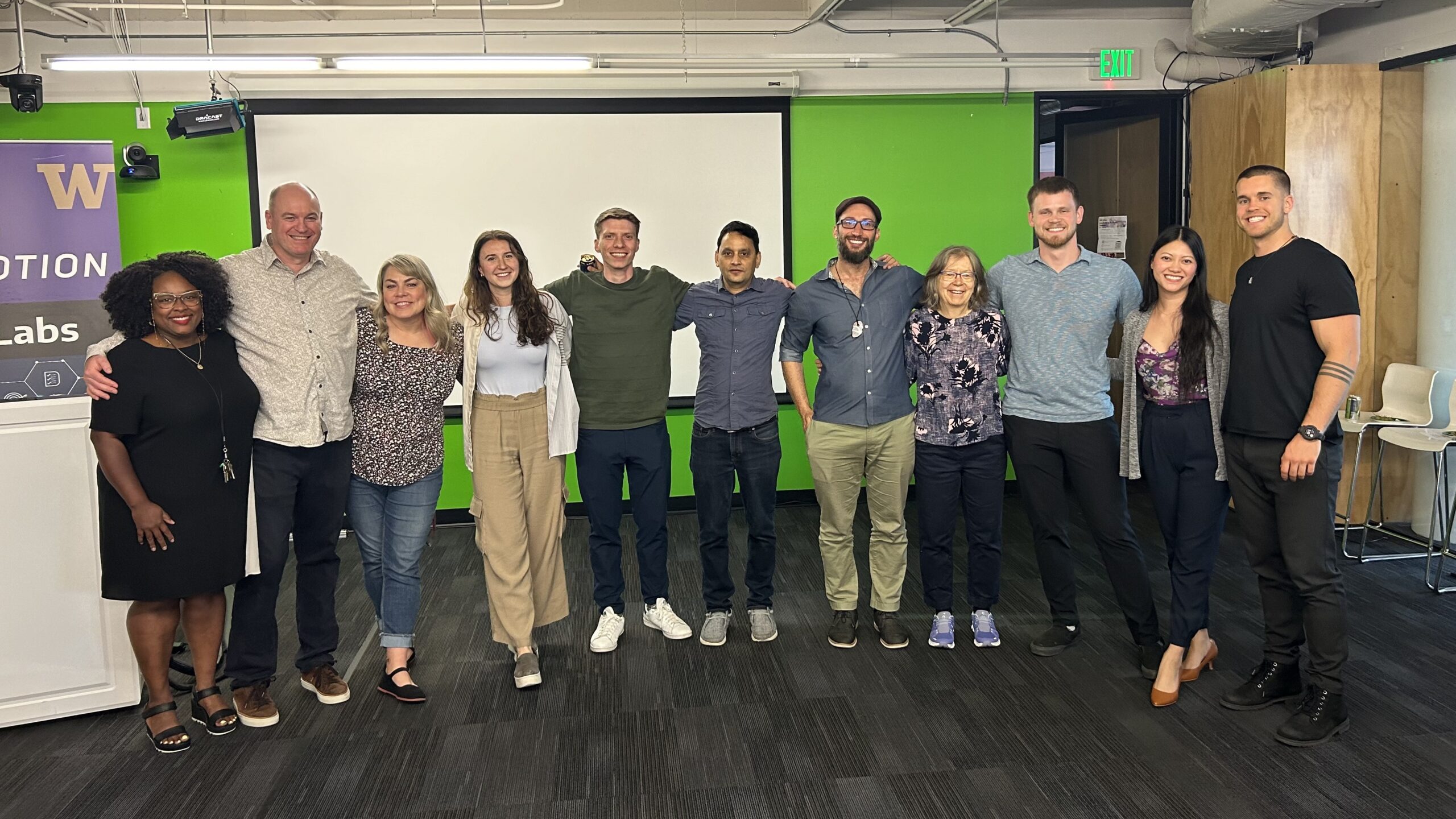 UW drama professor Cathy Madden poses with CoMotion Labs tech+ members at an improv workshop in May.