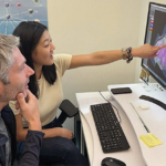 Postdoctoral fellow Jaime Chao and her immunology mentor, Michael Gerner, look over microscopy data together