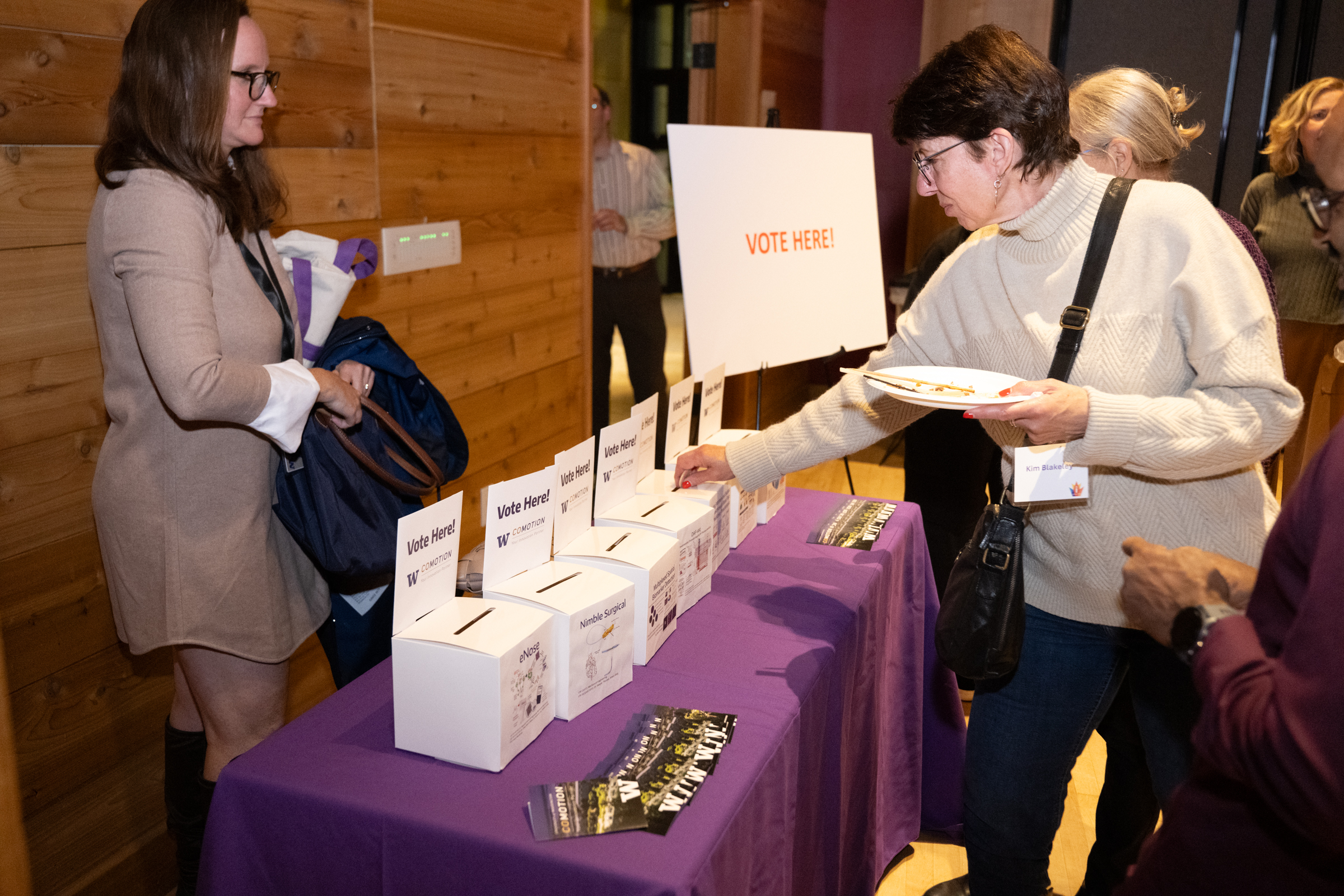 Attendees of the 2024 CoMotion Innovator Showcase cast their votes for best pitch