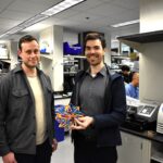 Archon Biosciences founders holding expandable toy that he uses to demonstrate how the company’s computationally designed Antibody Cages work.