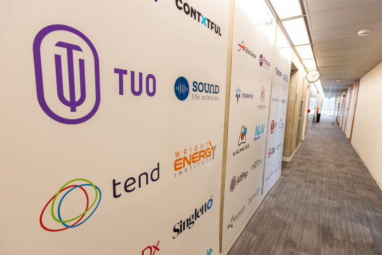 CoMotion HQ startup logo wall Sound Life Sciences and Singleton visible