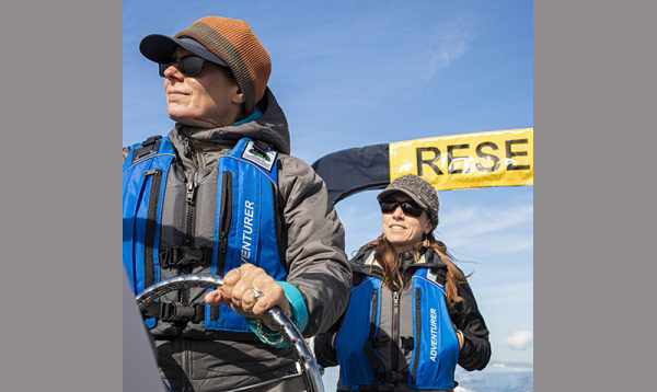 2 researchers on a boat