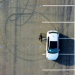 aerial view of car and bke adjacent