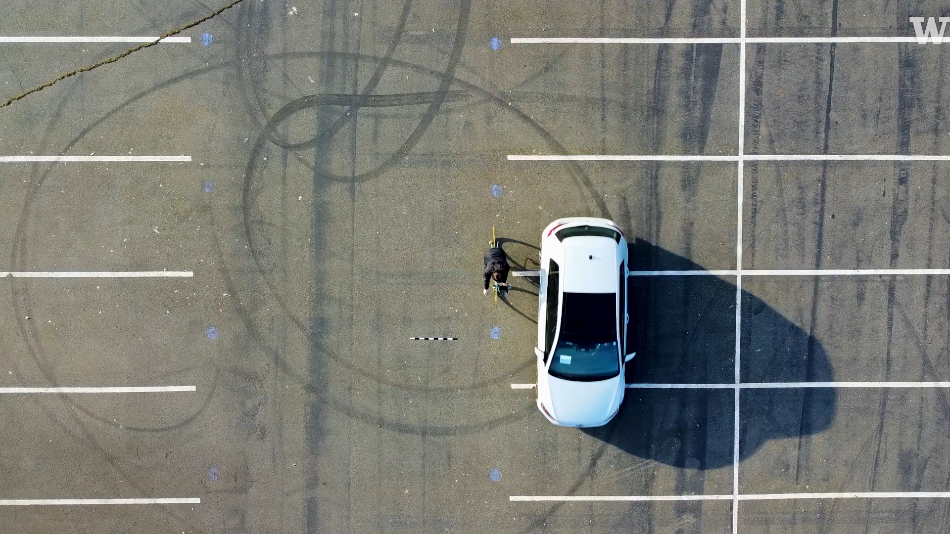 aerial view of car and bke adjacent