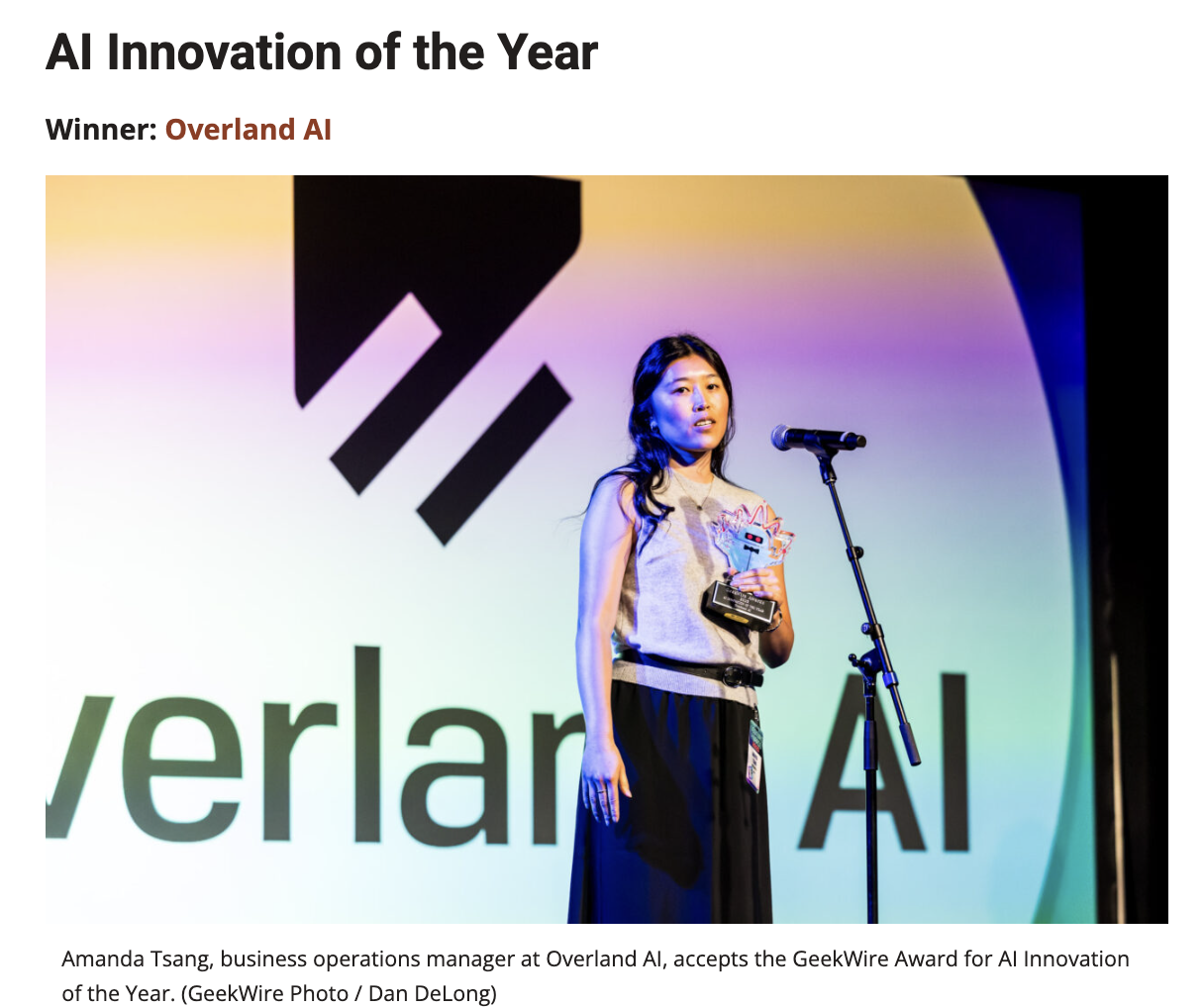 Amanda Tsang, business operations manager at Overland AI, accepts the GeekWire Award for AI Innovation of the Year.