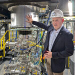 Matthew Thompson, Zap vice president of systems engineering, alongside a demo fusion reactors at the company’s Everett, Wash., research and development facility. (