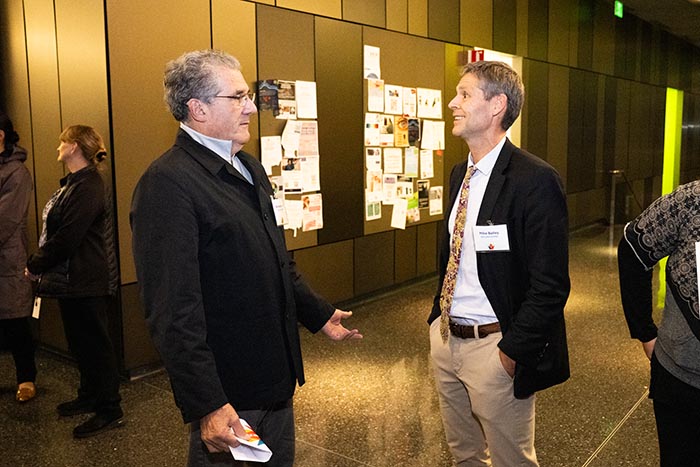 Michael Bailey with attendee at School of Medicine Inventor of the Year 2025