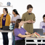 David Baker and team staged in lab and meeting tables