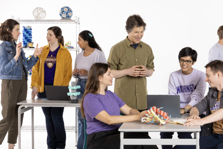 David Baker and team staged in lab and meeting tables