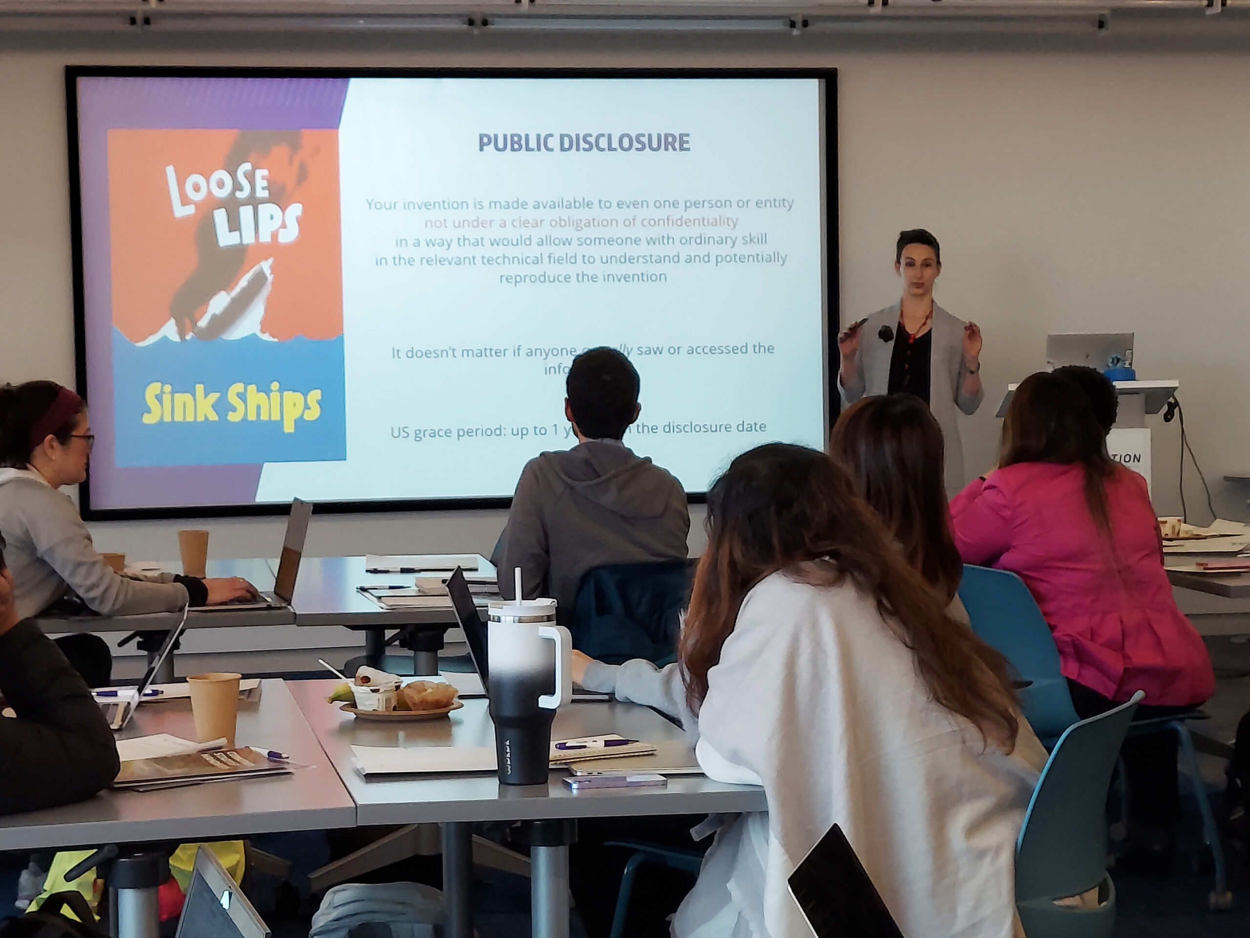 A lecturer delivering a presentation on an innovation training program