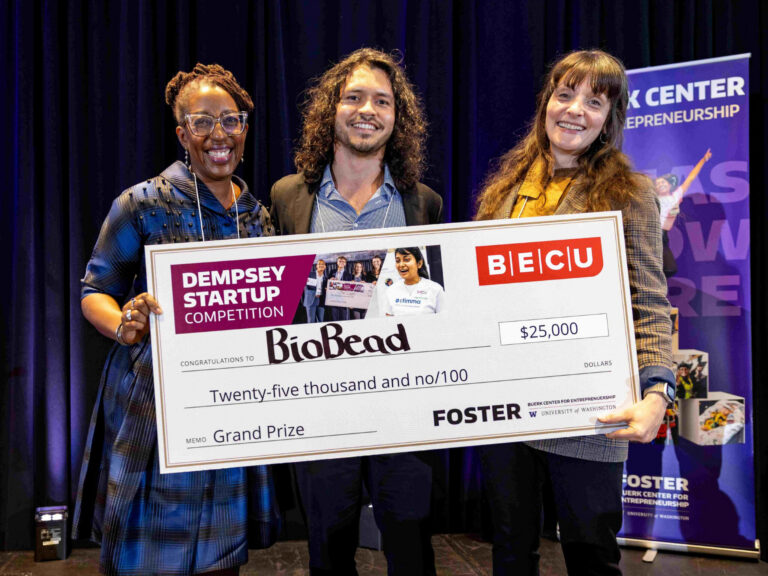 BioBead team holding winning check for the top prize at the Demsey Startup Competition